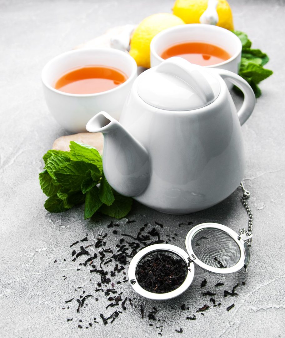 Tea with lemon and mint on a gray stone background